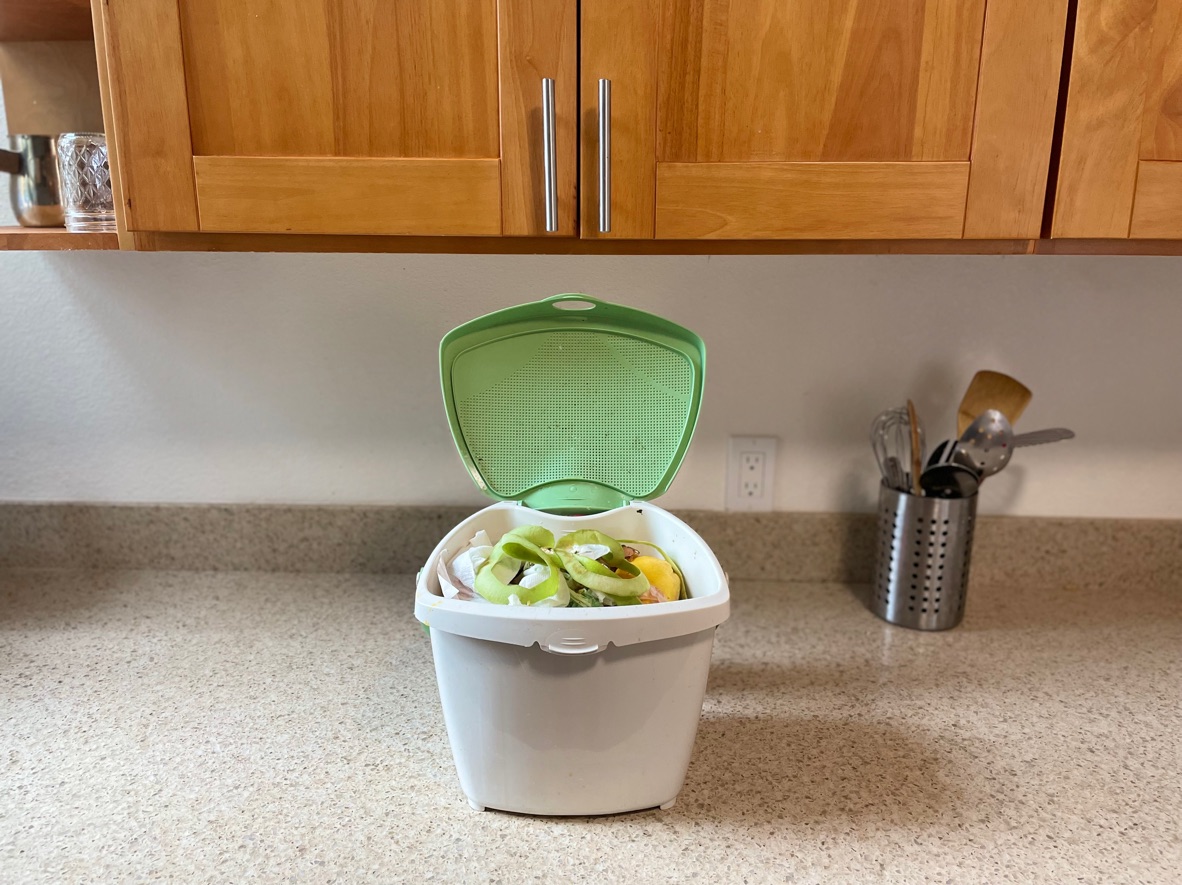 Kitchen compost pail with food scraps