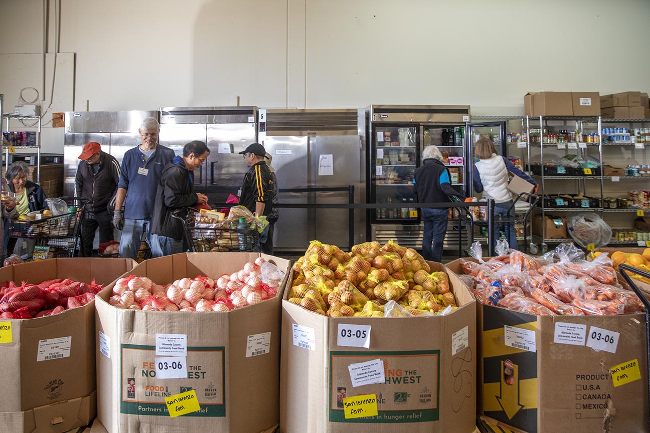 A network of food recovery organizations partner with businesses across Alameda County to donate healthy, surplus edible food to nourish communities. Here, staff and volunteers sort donated food at the San Lorenzo Family Help Center.
