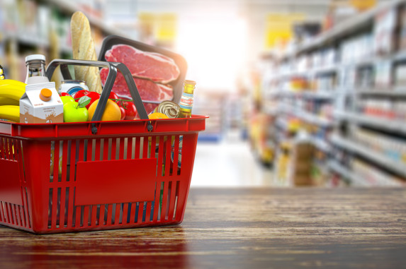 Red grocery basket filled with items