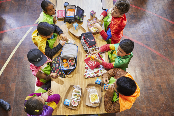 Bird's-eye view of students eating lunch in school cafeteria