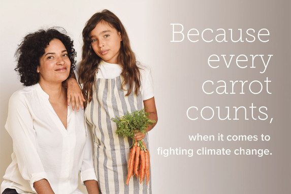 Mother and daughter holding a bunch of carrots, with ad headline that says "Because Every Carrot Counts when it comes to fighting climate change.