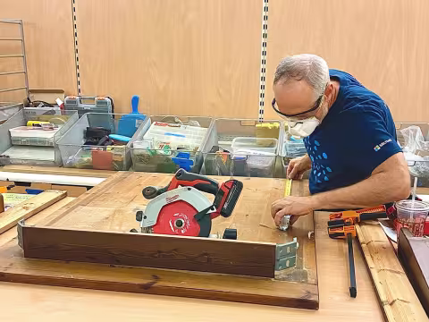 Volunteer altering table for new home. 